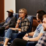 A lady speaking with mic in her hand