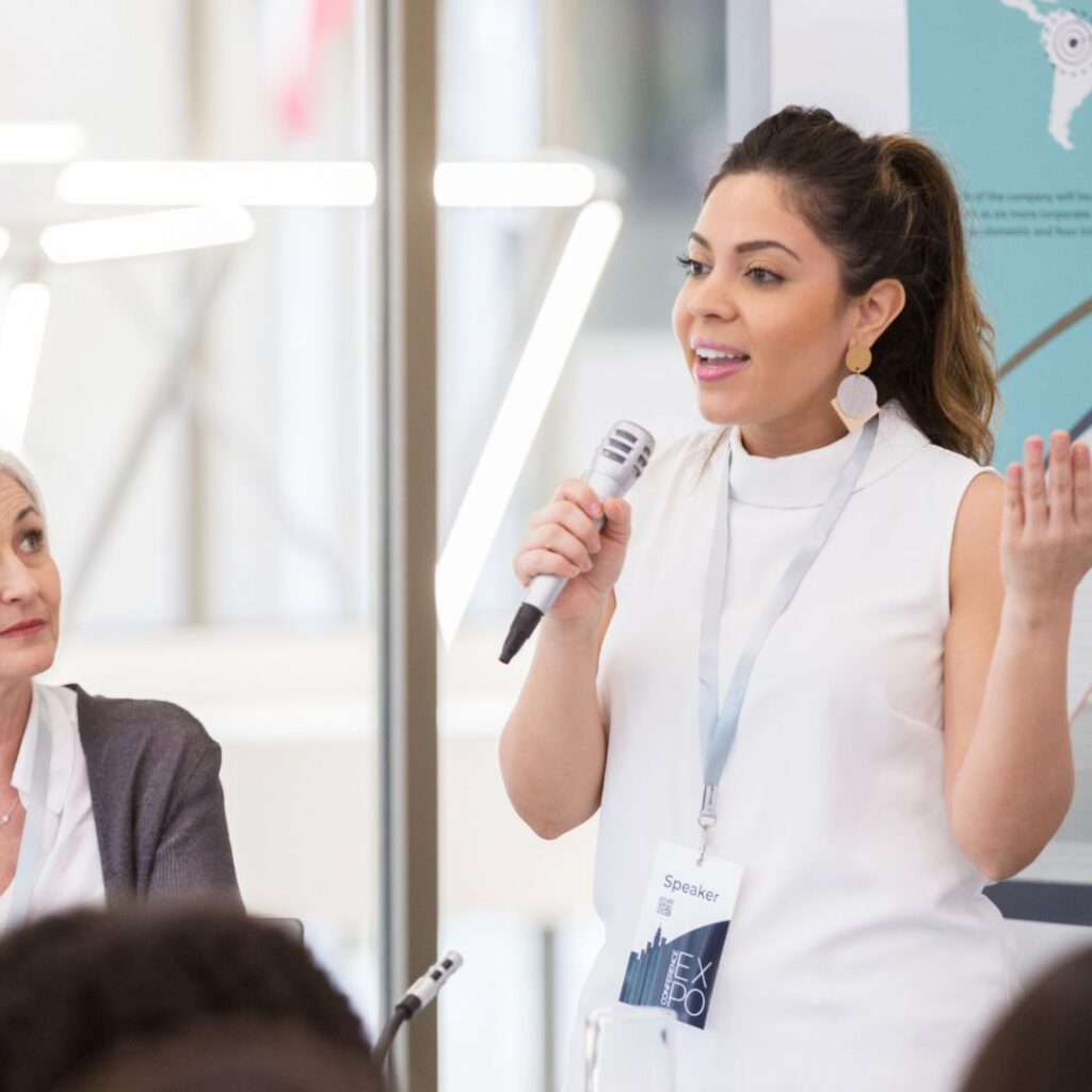 Professional speaker standing on an event.