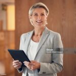 Smile, portrait and senior woman with tablet, happy lawyer in office with vision and legal success. Leadership, internet and corporate industry, mature businesswoman in management at advisory company