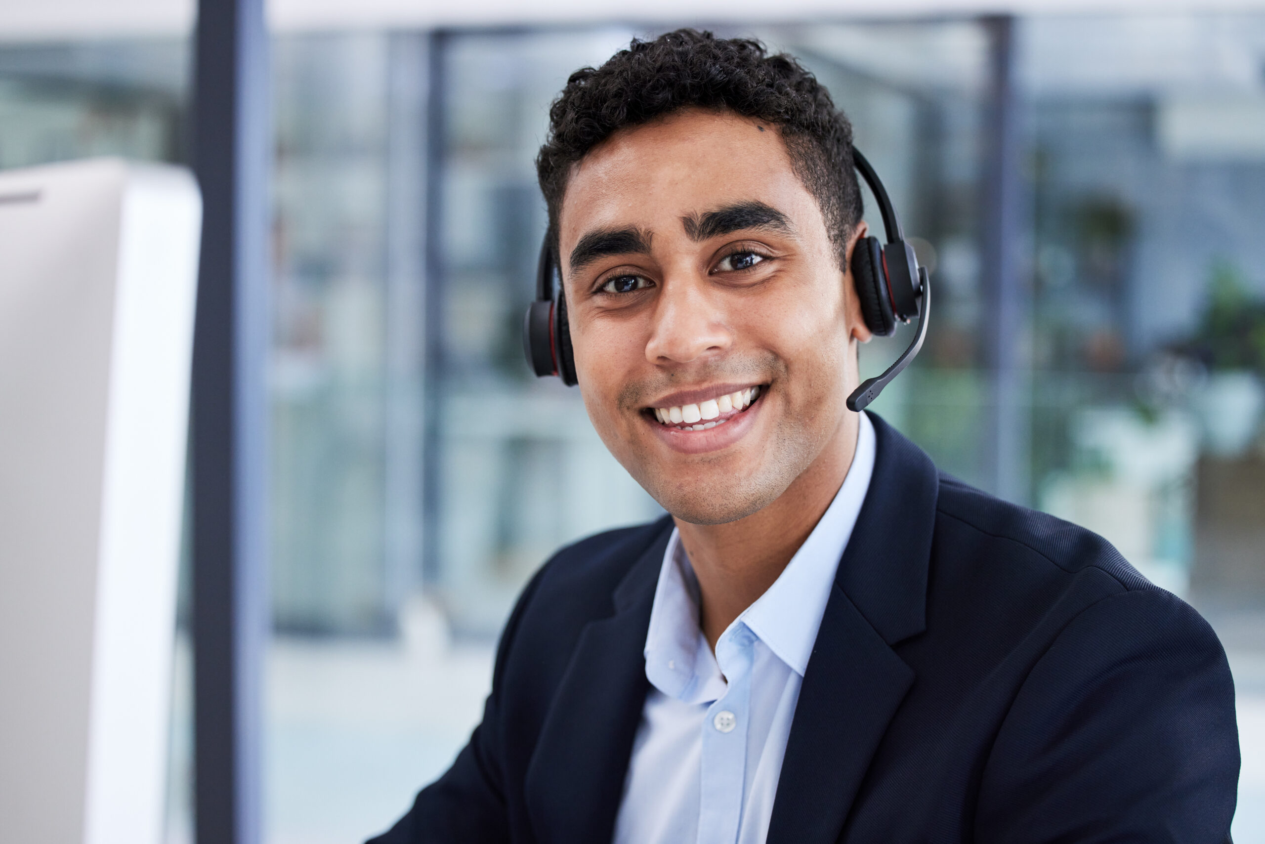 Businessman, call center and portrait smile for telemarketing, customer support or service at the office. Happy employee man consultant or agent smiling in contact us, help or online advice at desk.