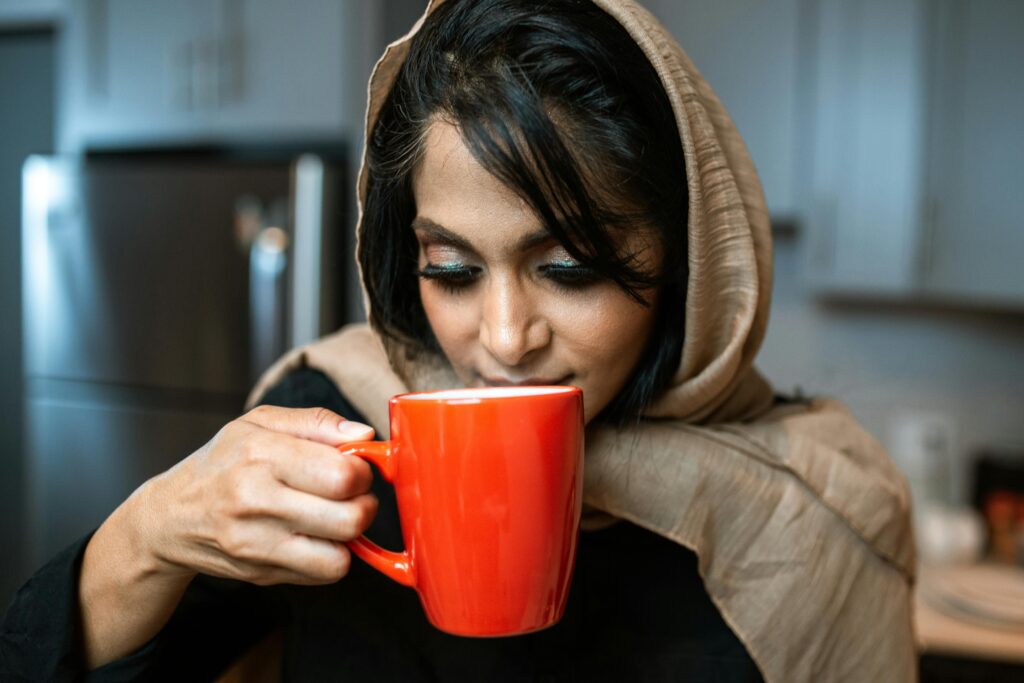 WOMAN SIPPING TEA