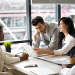 group-of-diverse-business-people-collaborating-in-office-or-multiethnic-business-people-in-meeting-photo